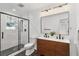 Beautifully updated bathroom with double vanity, sleek fixtures and glass enclosed shower at 1349 Lockhaven Sw Cir, Atlanta, GA 30311