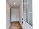 Bright entryway hallway featuring wood-look flooring and white trim at 1349 Lockhaven Sw Cir, Atlanta, GA 30311
