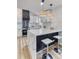 Bright kitchen with a breakfast bar, modern appliances, and stylish pendant lighting at 1349 Lockhaven Sw Cir, Atlanta, GA 30311