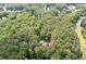 Stunning aerial perspective of the house nestled amongst lush trees at 220 Mars Hill Rd, Powder Springs, GA 30127