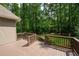 Expansive wood deck perfect for outdoor entertaining with wooded view and privacy at 220 Mars Hill Rd, Powder Springs, GA 30127