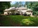 Exterior view of home highlighting the spacious backyard and multi-level design at 220 Mars Hill Rd, Powder Springs, GA 30127