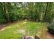 Enjoy this large, private backyard with mature trees and lush greenery at 220 Mars Hill Rd, Powder Springs, GA 30127