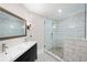 Modern bathroom with a glass shower and a dark vanity at 220 Mars Hill Rd, Powder Springs, GA 30127