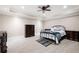 Spacious bedroom with tray ceilings, dark wood furniture, and tile floors at 220 Mars Hill Rd, Powder Springs, GA 30127