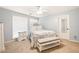 Bedroom with neutral colors, carpet flooring, bench seat, and lots of natural light at 220 Mars Hill Rd, Powder Springs, GA 30127