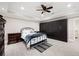 Elegant bedroom featuring ample closet space, modern lighting and tile floors at 220 Mars Hill Rd, Powder Springs, GA 30127