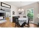 Cozy breakfast nook with hardwood floors, round table, and a view of the outdoor greenery at 220 Mars Hill Rd, Powder Springs, GA 30127