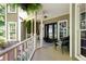 Charming front porch with wicker chair and welcome sign offers a cozy and inviting entrance to the home at 220 Mars Hill Rd, Powder Springs, GA 30127