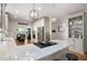 Bright kitchen featuring stainless appliances, white cabinets, granite countertops, and modern pendant lighting at 220 Mars Hill Rd, Powder Springs, GA 30127