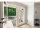 Spacious patio just off the bedroom featuring an outdoor living space and woodsy scenery at 220 Mars Hill Rd, Powder Springs, GA 30127