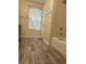 Clean bathroom with wood look floors and shower at 5030 N Bridges Dr, Alpharetta, GA 30022