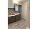 Bathroom featuring double vanities, tile flooring, and a shower at 5030 N Bridges Dr, Alpharetta, GA 30022