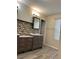 Bathroom features double vanities, tile flooring, and bright lighting at 5030 N Bridges Dr, Alpharetta, GA 30022