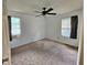 Modest bedroom featuring carpet, ceiling fan, and shaded windows at 5030 N Bridges Dr, Alpharetta, GA 30022