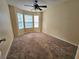 Cozy bedroom featuring carpet, ceiling fan, and bright windows at 5030 N Bridges Dr, Alpharetta, GA 30022