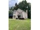 Charming two-story home with a manicured lawn and attached garage at 5030 N Bridges Dr, Alpharetta, GA 30022
