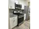 Modern kitchen with stainless steel appliances and granite countertops at 5030 N Bridges Dr, Alpharetta, GA 30022
