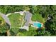 An aerial view of the home showcases its large swimming pool and lush green surroundings at 555 Valley Hall Dr, Atlanta, GA 30350