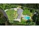 Aerial view of the property featuring a private swimming pool, lush landscaping, and a spacious backyard at 555 Valley Hall Dr, Atlanta, GA 30350