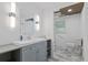 Modern bathroom with a gray vanity, sleek fixtures, and a handicap grab bar at 555 Valley Hall Dr, Atlanta, GA 30350