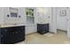 Spacious bathroom with dual sinks, dark vanities, and great lighting at 555 Valley Hall Dr, Atlanta, GA 30350
