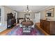 Spacious dining room boasts a decorative rug, elegant lighting, and classic decor, ideal for entertaining guests at 555 Valley Hall Dr, Atlanta, GA 30350