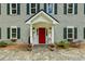 Inviting entrance with a red door, stone walkway, and well-maintained landscaping at 555 Valley Hall Dr, Atlanta, GA 30350