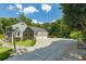 Spacious three car garage with an extended driveway and basketball court in a beautiful, wooded neighborhood at 555 Valley Hall Dr, Atlanta, GA 30350