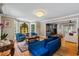 Bright living room features hardwood floors, bay windows with stained glass, and elegant furnishings at 555 Valley Hall Dr, Atlanta, GA 30350