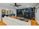 Comfortable living room with a white couch, hardwood floors, and a stylish navy media center at 555 Valley Hall Dr, Atlanta, GA 30350