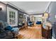Comfortable living room with hardwood floors, classic trim, and a view into the front room at 555 Valley Hall Dr, Atlanta, GA 30350