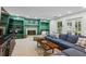 Basement Gathering room with fireplace, built-ins, and lots of seating at 555 Valley Hall Dr, Atlanta, GA 30350