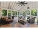 Comfortable screened porch with wicker furniture and views of the lush greenery at 555 Valley Hall Dr, Atlanta, GA 30350