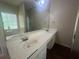 Bathroom with double sinks, large mirror, and bathtub at 76 Daisy Meadow Trl, Lawrenceville, GA 30044