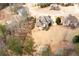 Aerial view of the backyard showing a pool and multiple homes in a wooded area at 1227 Castle Point Sw Ct, Conyers, GA 30094