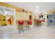 Finished basement with a bar area, barstool seating, and military-themed decor at 1227 Castle Point Sw Ct, Conyers, GA 30094