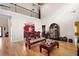 Spacious living room featuring a second-story balcony and decorative Asian-themed furniture at 1227 Castle Point Sw Ct, Conyers, GA 30094
