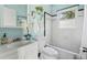 Charming bathroom featuring white fixtures, bright blue walls, and ample natural light at 240 Melrose Ave, Decatur, GA 30030