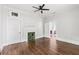 Spacious bedroom with hardwood floors, decorative fireplace, and ample natural light at 240 Melrose Ave, Decatur, GA 30030