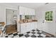 Functional kitchen with checkered floors and white cabinets at 240 Melrose Ave, Decatur, GA 30030