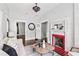 Cozy living room with fireplace, stylish light fixture, hardwood floors and neutral decor at 240 Melrose Ave, Decatur, GA 30030