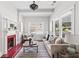 Cozy living room featuring a fireplace, neutral decor, and bright natural light at 240 Melrose Ave, Decatur, GA 30030