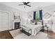 Light-filled main bedroom with fan, neutral palette, and ensuite access at 240 Melrose Ave, Decatur, GA 30030