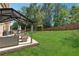 Large backyard boasts a spacious patio with an outdoor seating area and a lush lawn at 2629 Muskeg Sw Ct, Atlanta, GA 30331