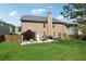 Exterior of the home showcases a sprawling green lawn with a patio and an outdoor seating area at 2629 Muskeg Sw Ct, Atlanta, GA 30331