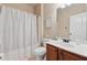 Clean bathroom featuring a combination tub and shower, a single sink and a white shower curtain at 2629 Muskeg Sw Ct, Atlanta, GA 30331