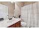 Clean and functional bathroom with a large mirror, vanity, toilet and a combination tub and shower at 2629 Muskeg Sw Ct, Atlanta, GA 30331