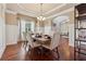 Elegant dining room with hardwood floors, wainscoting, and an open design at 2629 Muskeg Sw Ct, Atlanta, GA 30331