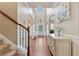 Elegant home foyer featuring hardwood floors, a staircase, and a decorative console table at 2629 Muskeg Sw Ct, Atlanta, GA 30331